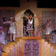 Charlotte Page and chorus of grisettes on staircase